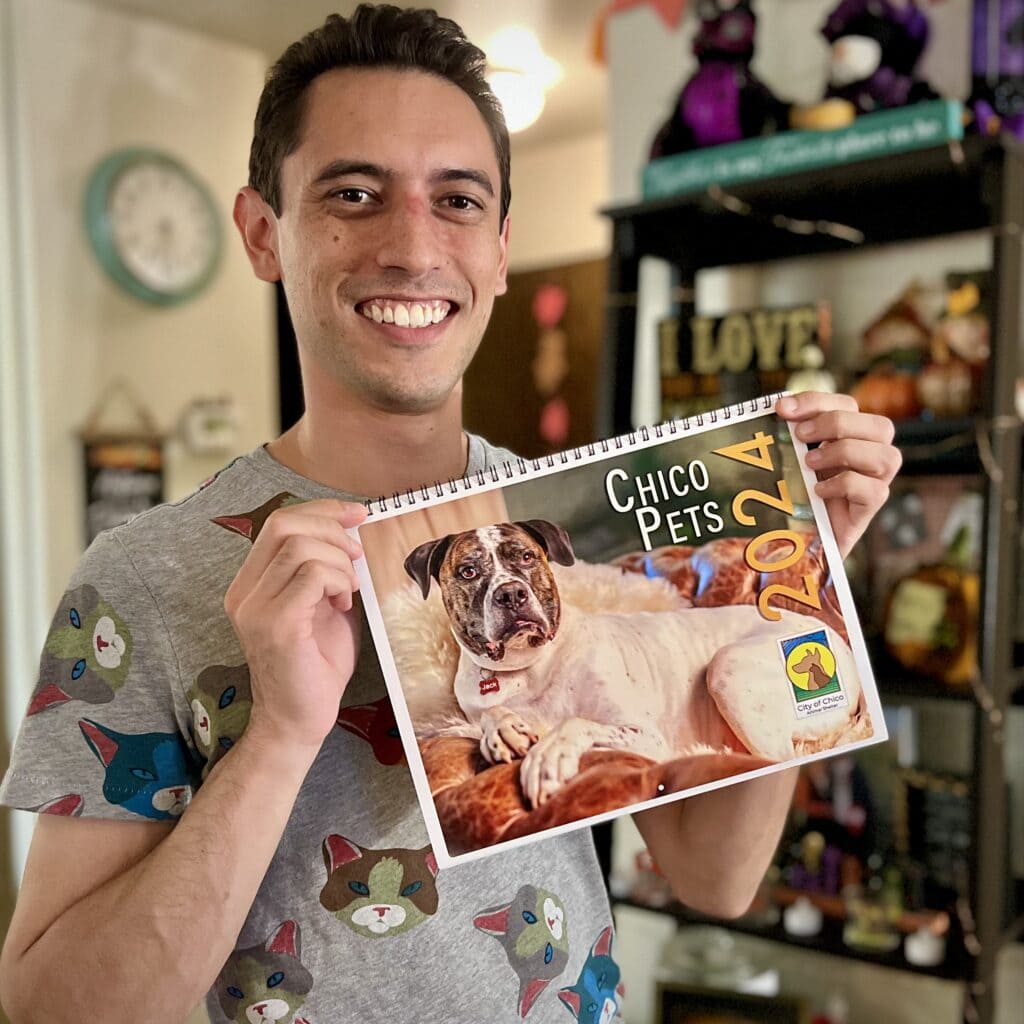 Jonathan looking happy while holding up his calendar